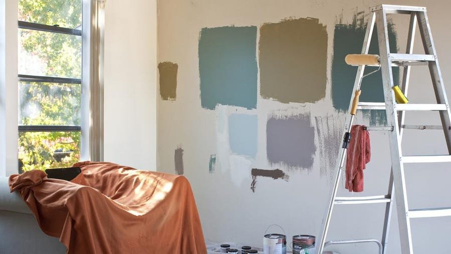 Painter applied test color on wall to help homeowner make a choice