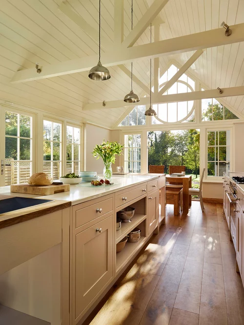 White shiplap cathedral ceiling with exposed beams, shaker cabinets, modern kitchen renovation, high windows, natural light, greenery view, traditional and modern design, Vancouver Island.
