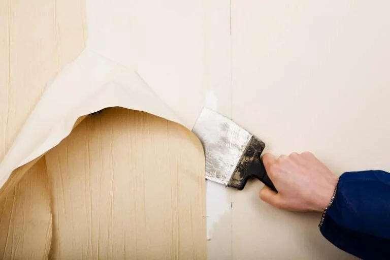 Transform your space: Skilled painters carefully removing wallpaper and deliver meticulous results .