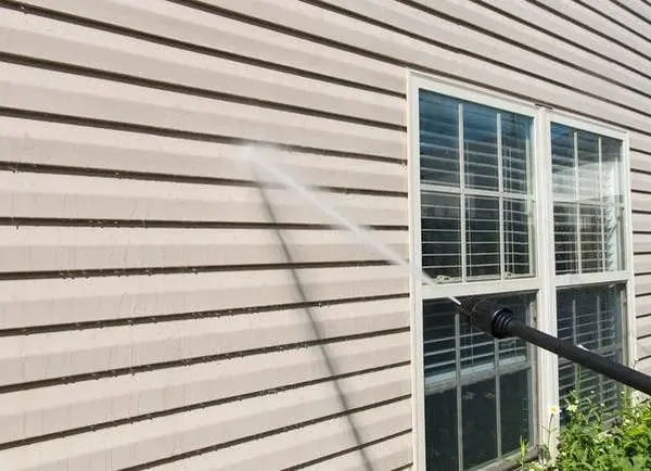 Apainter pressure washing houses siding  prior painting