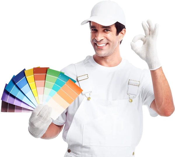 Painter in whites smiling , with his left hand hold a color fan and make a thumbs up with his right hand