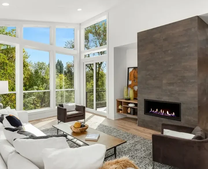 Living room with high windows and bright ceilings that had complete repairs and painting